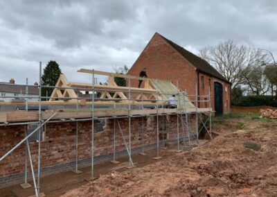 new barn conversion exterior roof half constructed