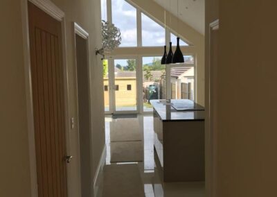 new build kitchen with shiny worktops